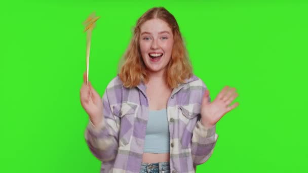 Magician witch young woman gesturing with magic wand fairy stick, making wish come true, casting magician spell, advertising holidays sale discount. Caucasian girl isolated on chroma key background - Footage, Video