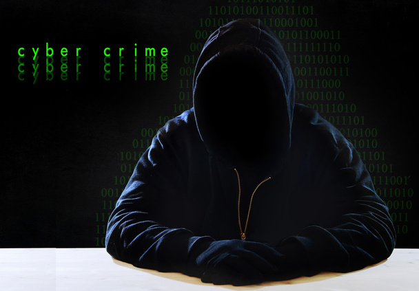 hacking expert man in hood as sensitive information cracker cyber crime concept - Photo, Image