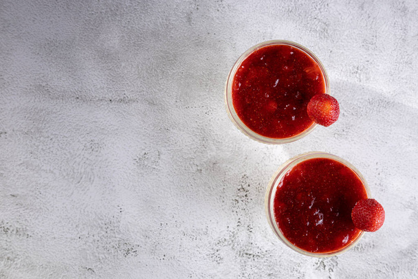 Dessert of creamy pudding and strawberry jam. Panna cotta. - Photo, Image