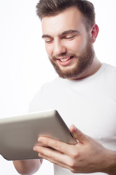 young man  using a tablet computer - Foto, Bild