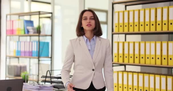 Confident successful young woman extends her hand in the office. Greeting your partner and shaking hands - Footage, Video