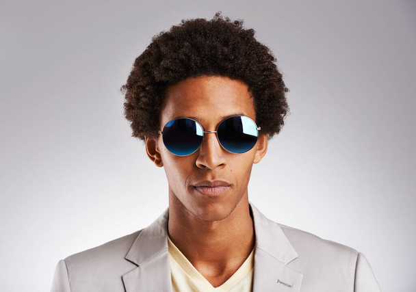 Portrait, business and sunglasses with black man in studio on gray background for career, fashion or style. Face, job and suit with confident young employee or model in shades for professional work. - Foto, Imagen