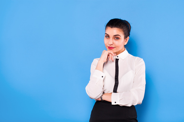 Business woman in formal wear on blue background - Foto, Bild