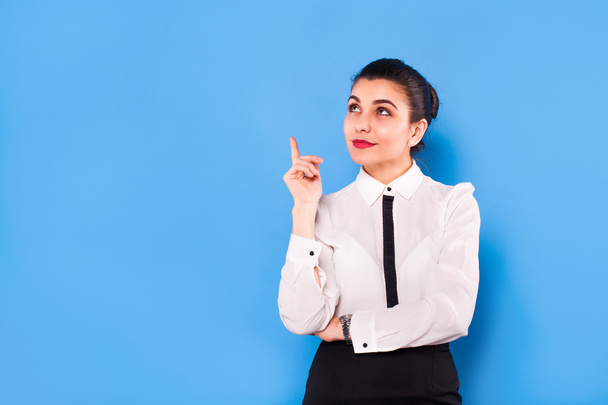 Business woman in formal wear on blue background - Photo, image