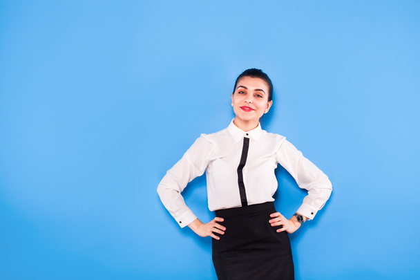 Business woman in formal wear on blue background - Φωτογραφία, εικόνα