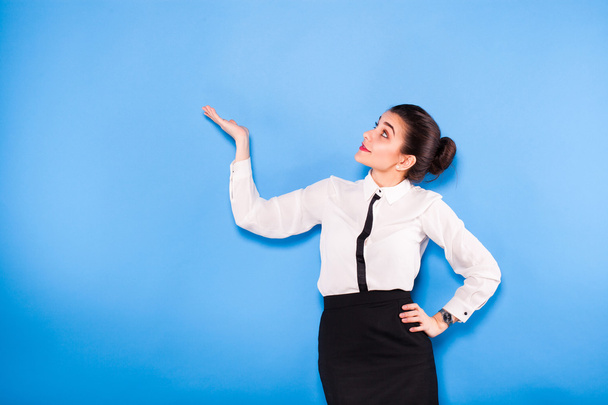 Business woman in formal wear on blue background - Photo, image