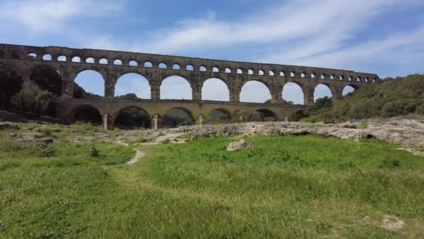 Ancient Roman aqueduct, Pont du Gard, under a clear blue sky in picturesque Provence, near Nimes city in France - Footage, Video