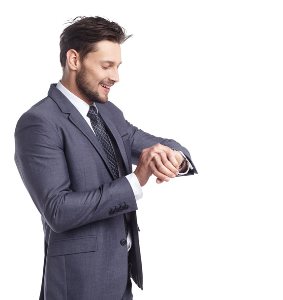 Young business man looking at watch - Photo, image