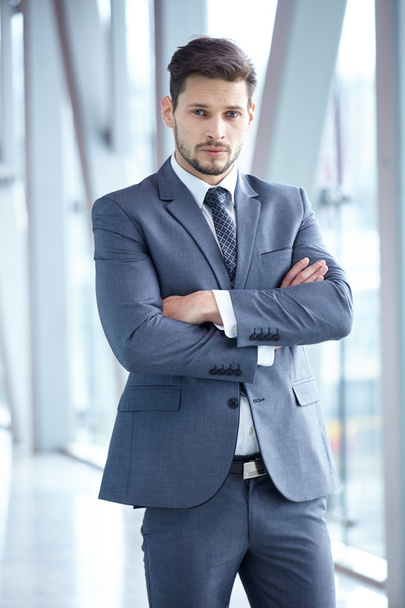 Businessman in suit standing at office - Photo, Image