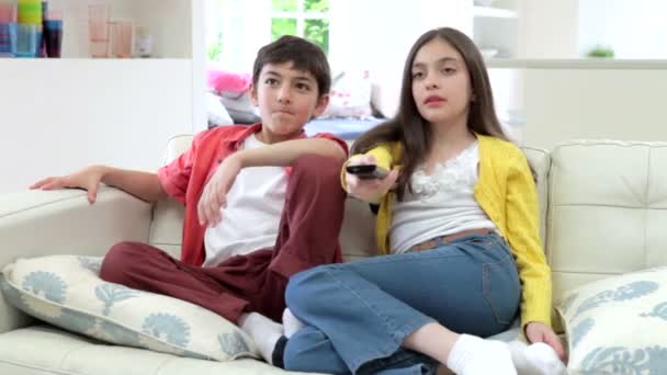 Two Hispanic Children Sitting On Sofa - Video, Çekim