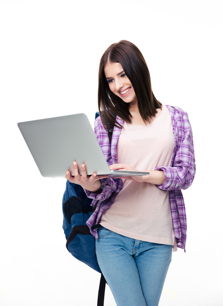 Smiling woman standing with laptop - Foto, Bild