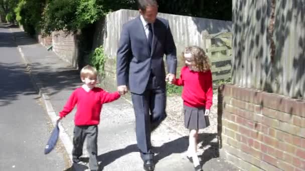 Father Walking To School With Children - Metraje, vídeo