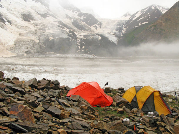Tourist tents in mountains - Фото, зображення