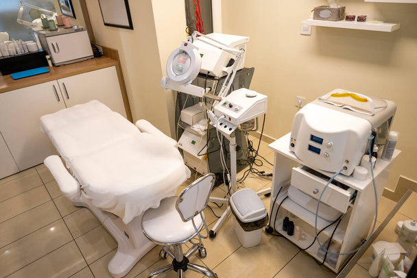 High angle view of modern equipment in the beauty salon. Medical equipment for cosmetology in Beautician cabinet. - Photo, Image