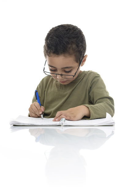 Cute Young Schoolboy Studying with Concentration - Foto, afbeelding