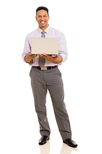 middle aged businessman holding laptop - Фото, зображення