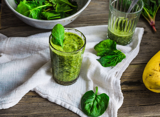 green smoothie with spinach leaves, banana with peanut milk in a - Фото, зображення