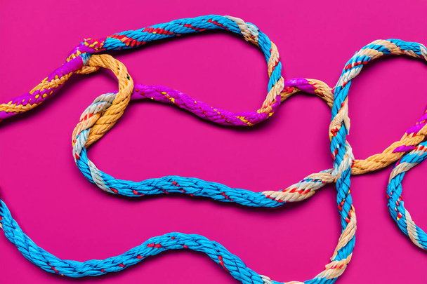 Team rope diverse strength connect partnership together teamwork unity communicate support. Strong diverse network rope team concept integrate braid color background cooperation empower power. - Photo, Image