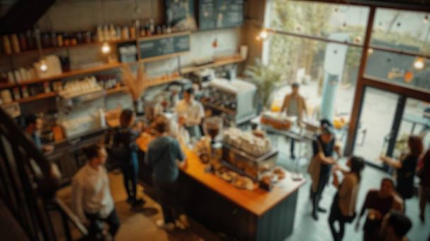 Zamazane tło ruchliwej kawiarni z patronami delektującymi się drinkami i baristami przygotowującymi kawę, tworzącymi tętniącą życiem przestrzeń społeczną. Wspaniałe.. - Zdjęcie, obraz