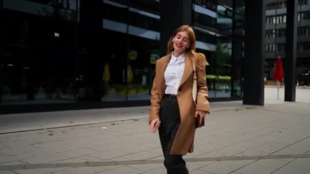 Happy excited businesswoman young entrepreneur celebrating victory, dancing with smartphone on street, having fun, enjoy job opportunities. Career people and celebration concept - Footage, Video