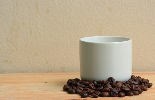 Koffie in cup op hout achtergrond - Foto, afbeelding