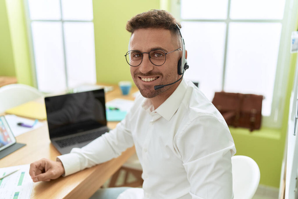 Young hispanic man call center agent working at office - Photo, Image