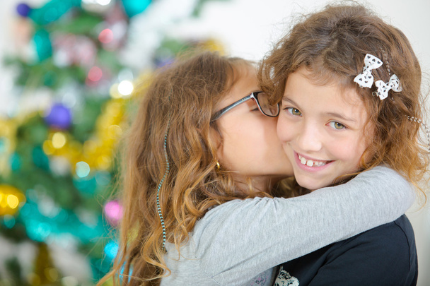 Two young sisters at Christmas - Photo, Image
