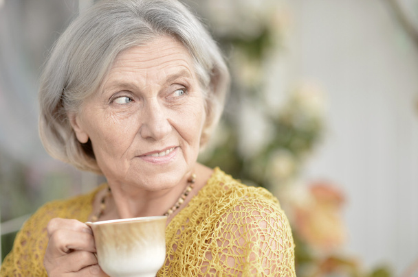 Senior woman with cup of coffee - Fotografie, Obrázek