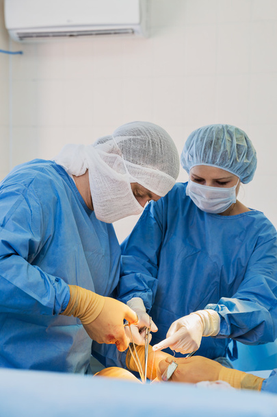 Surgeons in operating room - Фото, изображение