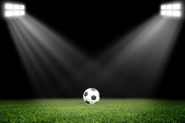 Soccer ball on field in stadium at night - Photo, Image