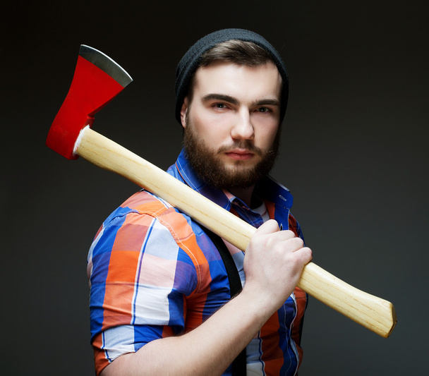 Young bearded man with  big axe - Foto, imagen