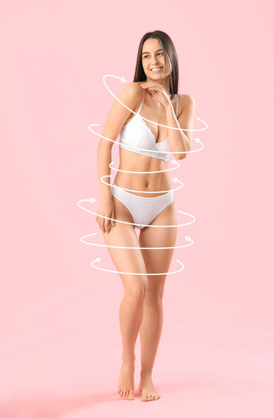 Beautiful young woman in underwear on pink background. Diet concept - Photo, Image