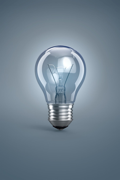 Light bulb on grey - Foto, Imagen
