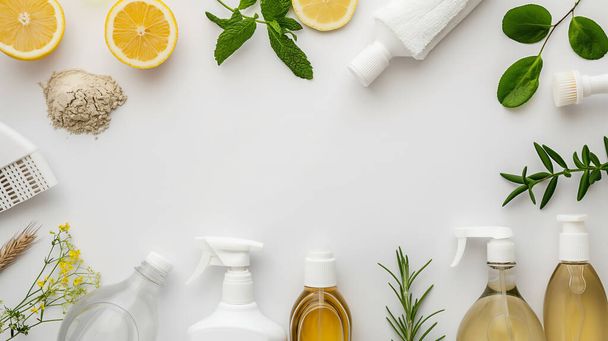 Natural cleaning products and ingredients displayed on white background, suggesting eco-friendly cleaning. - Photo, Image
