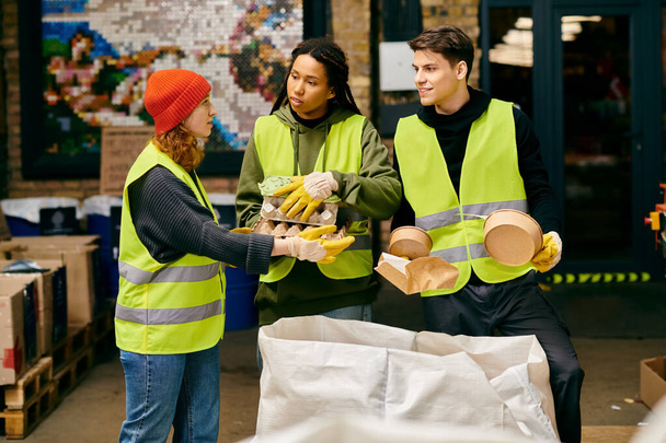 Young volunteers in safety vests sorting bananas for a sustainable cause. - Zdjęcie, obraz