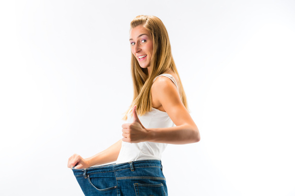 Γυναίκα με μεγάλο παντελόνι - απώλεια βάρους - Φωτογραφία, εικόνα