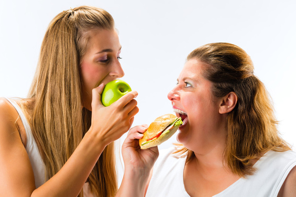 Dunne en dikke vrouw eten - Foto, afbeelding