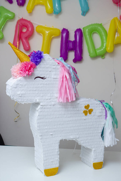 piata white unicorn, children's game with birthday candies - Photo, Image