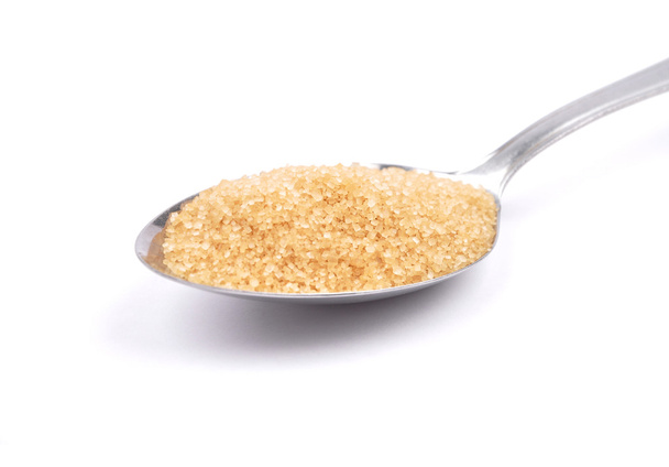 Zucchero di canna marrone su cucchiaio
 - Foto, immagini