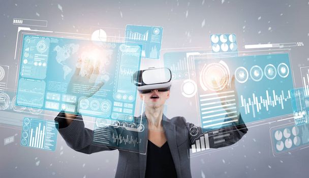 Skilled business woman pointing at financial data while wearing VR glasses. Professional project manager looking at marketing strategy while connecting with metaverse and visual reality. Contraption. - Photo, Image