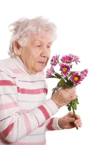 The old woman with a bunch of flowers - Foto, immagini