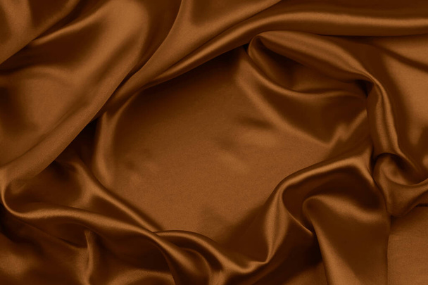 Крупный план линий из коричневой шелковой ткани  - Фото, изображение