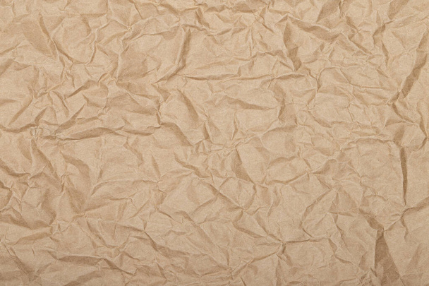 Hnědé vrásky recyklovat papír pozadí, Brown Craft zmačkaný papír, lepenkové pozadí. - Fotografie, Obrázek