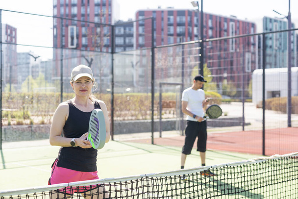  paddle tennis couple players ready for class. High quality photo - Photo, Image