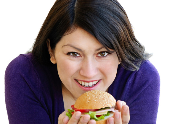 Woman eating sandwich - Фото, зображення