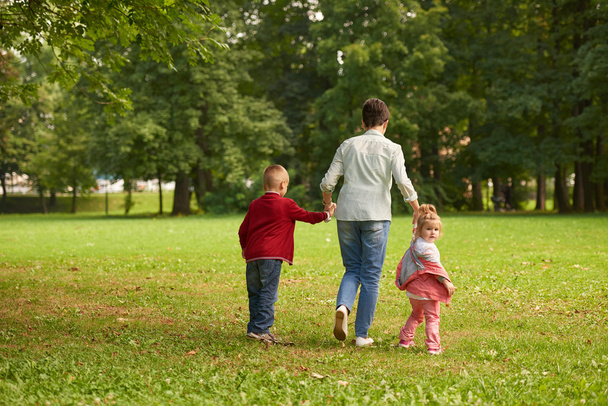 Happy family together outdoor in park - Fotografie, Obrázek