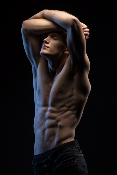 Portrait of handsome red-haired athlete topless at the studio - Фото, зображення