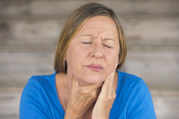 Woman in pain with throat ache from flu - Fotó, kép