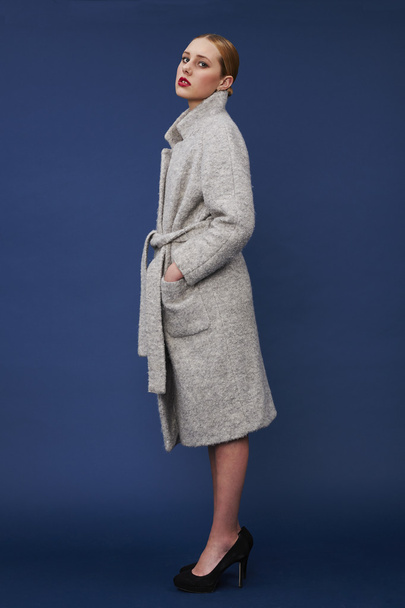 Young woman in gray coat - 写真・画像