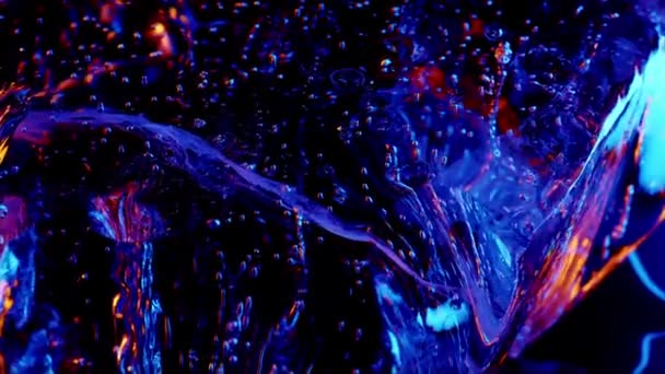 Kostka lodu na kolorowym świetle ognia. abstrakcyjna tapeta - Materiał filmowy, wideo